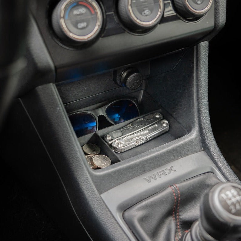 Subaru WRX 2015-2021 custom-fit black ABS plastic center console organizer by VOXELWERKZ with compartments for sunglasses, tools, and change, enhancing interior functionality.